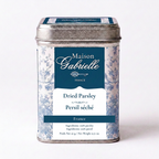 A metal tin of Maison Gabrielle Parsley from France, featuring a blue and white floral pattern with a dark blue label, set against a plain white background.