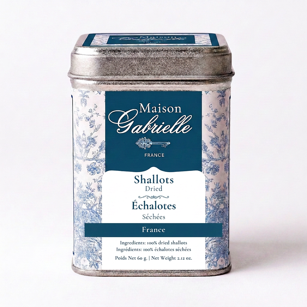 A metal tin of Maison Gabrielle Shallots from France, featuring a blue and white floral pattern with a dark blue label, set against a plain white background.