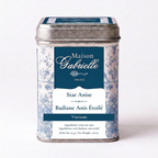 A metal tin of Maison Gabrielle Star Anise (Badiane Anis Étoilé) from Vietnam, featuring a blue and white floral pattern with a dark blue label.